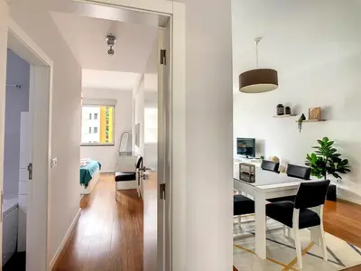 a small apartment with a desk and a dining room at Alameda Apartment by LovelyStay in Funchal