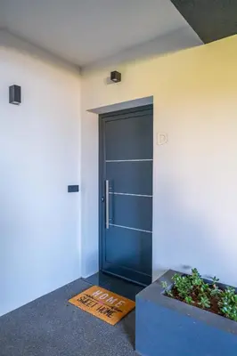 a blue door in the corner of a room at FLH Amazing Ocean View with Balcony in Santa Cruz
