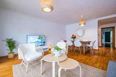a living room with white chairs and a table at Lovely apartment at the best location in Funchal in Funchal