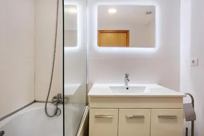 a bathroom with a sink and a shower at Costa Avila 2 in Caniço