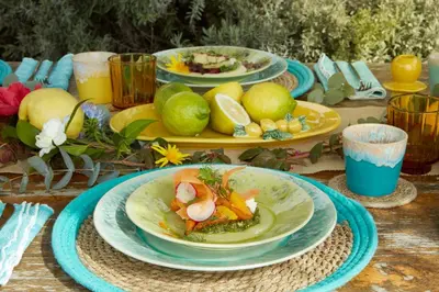 a table with plates of food on top of it at Yeotown Madeira Wellness Hotel and Nature Stay in Arco da Calheta