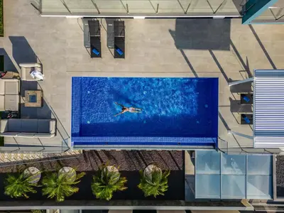 an overhead view of a person swimming in a pool at Villa Boa Nova Preta by LovelyStay in Funchal