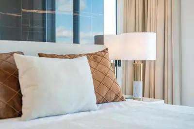 a bed with a lamp next to a window at Villa Boa Nova Preta by LovelyStay in Funchal
