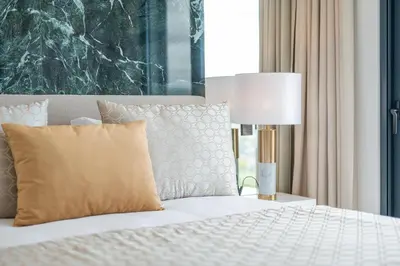 a bedroom with a bed with a lamp and a window at Villa Boa Nova Verde by LovelyStay in Funchal