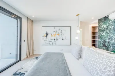 a bedroom with a bed and a large window at Villa Boa Nova Verde by LovelyStay in Funchal