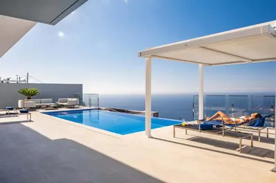 a villa with a swimming pool with a view of the ocean at Villa Boa Nova Branca by LovelyStay in Funchal