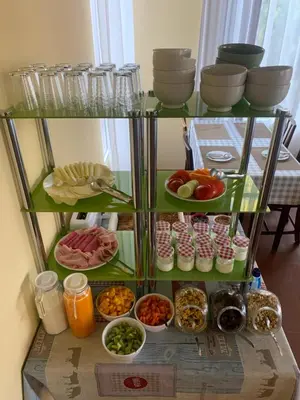 a shelf filled with different types of food at Casa De Cha Prazeres in Prazeres