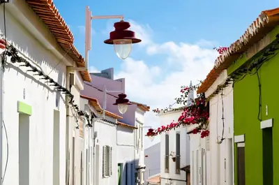 a street in a town with a street light and buildings at Villa Sagres Surf in Sagres