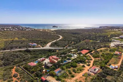 an aerial view of a house and the ocean at Villa Cercado, private swimming pool in Sagres