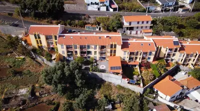 an overhead view of a group of houses with orange roofs at Vista Mar by Atlantic Holiday in Caniço