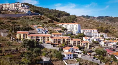 a town on a hill with houses at Vista Mar by Atlantic Holiday in Caniço