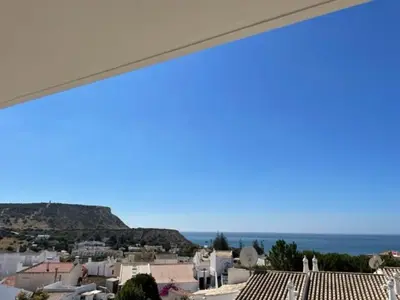 a view of a city from a balcony at Appartement Praia da Luz - 2 Personnes - Vue mer in Luz