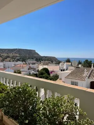 a view of a city from a balcony at Appartement Praia da Luz - 2 Personnes - Vue mer in Luz