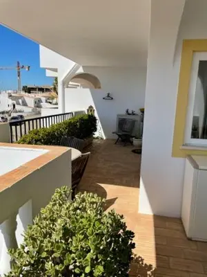 a view of a balcony of a house at Appartement Praia da Luz - 2 Personnes - Vue mer in Luz