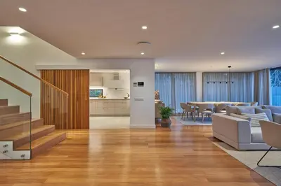a living room with a dining room and a kitchen at La Villa at The Cliff Bay - PortoBay in Funchal