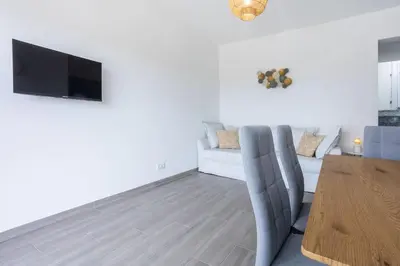 a living room with a couch and a table at Casa Monte Salema in Vila do Bispo
