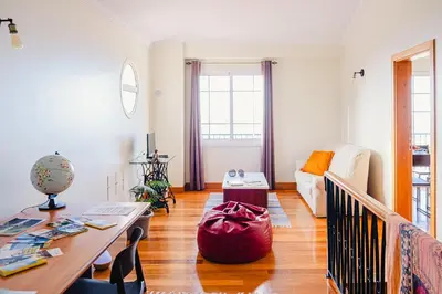 a balcony with a table and chairs and a view at Namastê House I in Relógio do Poiso
