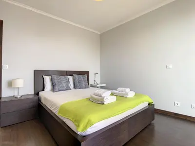 a bedroom with a large bed with towels on it at Sunny Side by Atlantic Holiday in Madalena do Mar