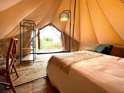 a bedroom with a bed in a tent at Porto Santo Destination in Porto Santo