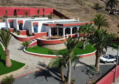 an aerial view of a house with palm trees at Porto Santo Destination in Porto Santo