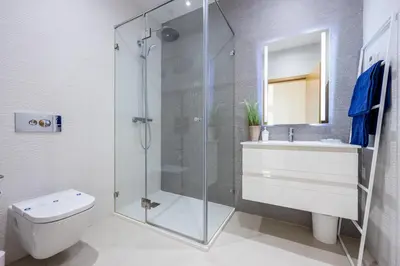 a bathroom with a shower and a toilet and a sink at CoolHouses Algarve Lagos, 3 Bed modern Flat, outdoor & Indoor pools, Gym, Amor à Vida in Lagos