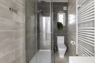 a bathroom with a shower and a toilet in it at Casa Almargens in Aljezur by Lisbeyond in Bordeira
