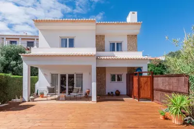 a white house with a patio in front of it at Casa Almargens in Aljezur by Lisbeyond in Bordeira
