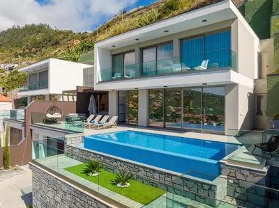 an image of a house with a swimming pool at Luxury Villa Bianca by Holiday Rental Madeira in Arco da Calheta