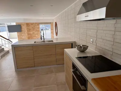 a kitchen with a sink and a counter top at Casa da Pedreira in Porto Santo