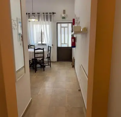 a bedroom with a bed and a bathroom at Cabo de Sagres -1 bedroom apartment in Sagres