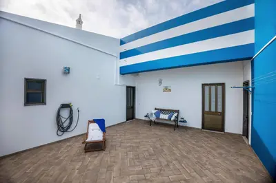 a large room with a blue and white wall at Cabo de Sagres -2 bedroom apartment in Sagres