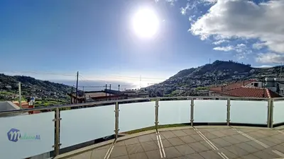 a view from the balcony of a building with a mountain at Yohanna's accommodation in Campanário