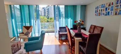 a dining room with a table and chairs and a large window at Lindas Holiday Apartment in Funchal
