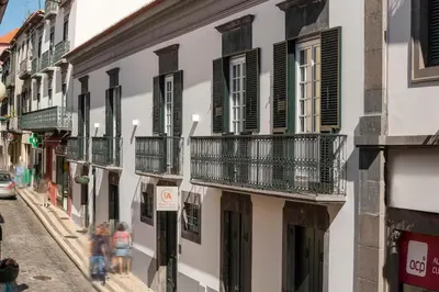 a group of buildings with balconies on a street at FAA Belas Artes by An Island Apart in Funchal