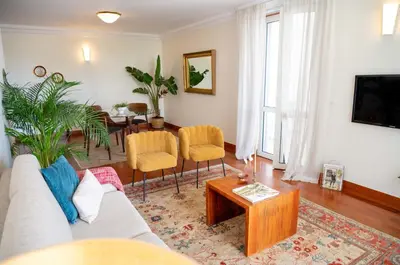 a mirror reflecting a living room with a couch at Madeira Precious Penthouse in Funchal