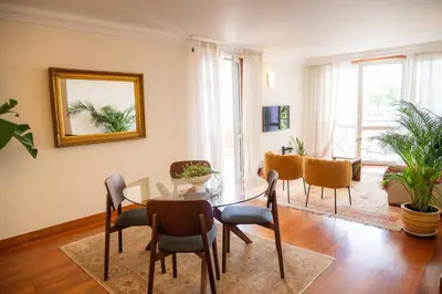 a bedroom with a white bed and a window at Madeira Precious Penthouse in Funchal