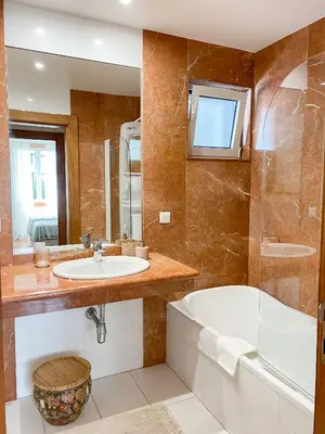a bathroom with two sinks and a large mirror at Madeira Precious Penthouse in Funchal