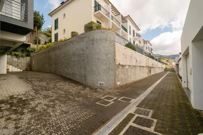 an empty street in a city with buildings at Ponta do Sol Amazing 3 Bedroom Apartment in Ponta do Sol