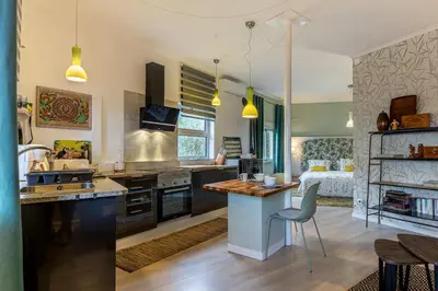 a kitchen with a sink and a counter top at Villa Sophia by ALMA Holiday Rentals in Caniço