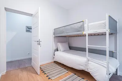 a bedroom with two bunk beds and a closet at CASA DA ROCHINHA in Funchal