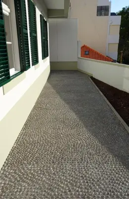 a walkway outside of a building with windows at CASA DA ROCHINHA in Funchal
