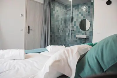 a hospital room with two beds and a shower at Laurus - Charming House in Raposeira