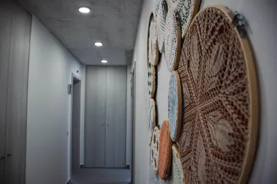 a hallway with a wall with plates on it at Laurus - Charming House in Raposeira