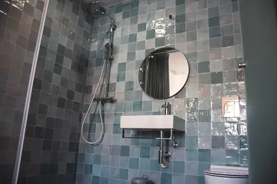 a bathroom with a sink and a mirror at Laurus - Charming House in Raposeira