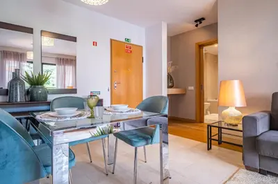 a kitchen with blue cabinets and a sink at Living Funchal by Homie in Funchal