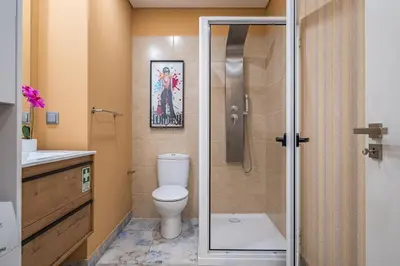 a bathroom with a toilet and a shower at Urban Paradise by Homie in Funchal