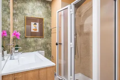 a bathroom with a sink and a shower at Urban Paradise by Homie in Funchal