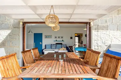 a living room with a dog laying on a couch at Casa da Praia in Vila Baleira