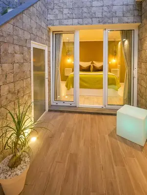 a room with a bedroom with a bed in it at Little Townsuite Funchal in Funchal