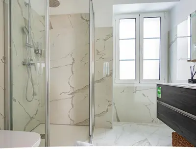 a bathroom with a shower with a glass door at Casa de Sao Tiago 2 in Funchal